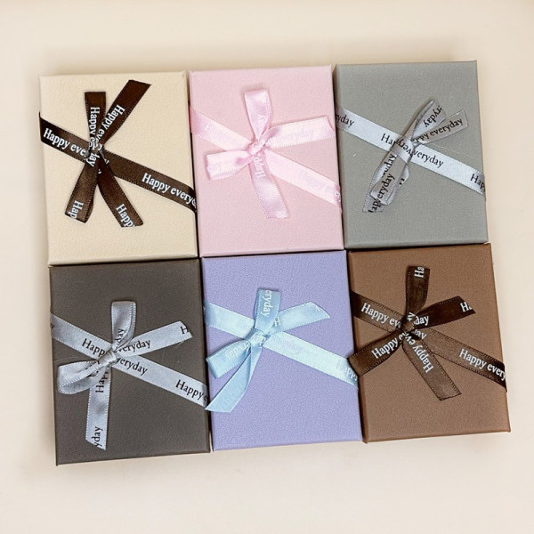 Коробочки для прикрас з єфектом шкіри з атласним бантиком