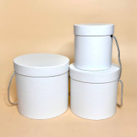 Круглі коробки для подарунків із кришкою та ручкою білого кольору