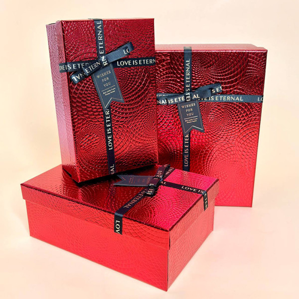 Набір тексурних коробок зі стрічкою червоного  кольору