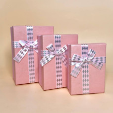 Набір подарункових коробок з декоративними бантами  рожевого кольору
