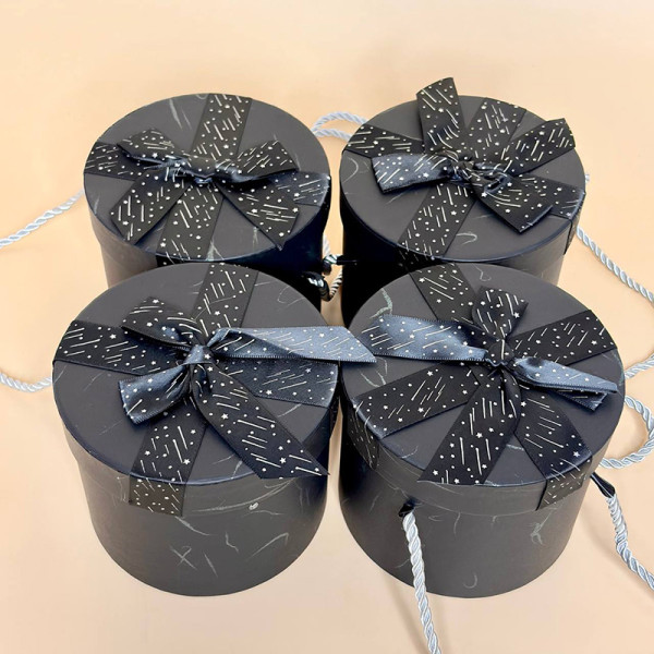 Подарункові коробки циліндричні з кришкою та бантиком чорного кольору