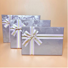 Набір прямокутних подарункових коробок з бантом світло рожевого кольору