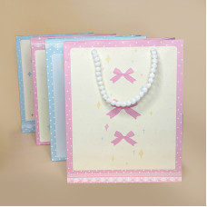 Подарунковий пакет із декоративними ручками