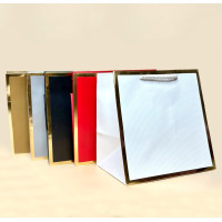 Пакети подарункові з золотистою рамкою серія "Куб" розмір M