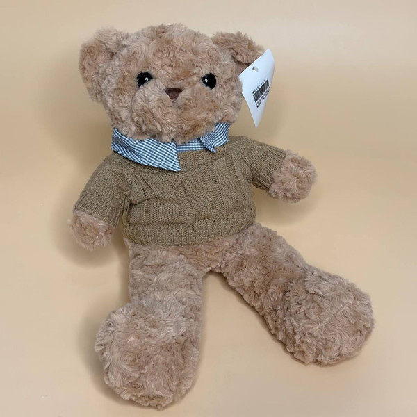 М’яка плюшева іграшка ведмедик у светрі коричневого кольору